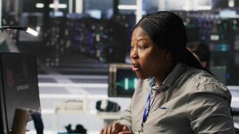 Scared server room technician responding to hacking attack, requesting help Stock Footage 309624295