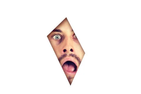 Scared shocked man looking though a gap in a white paper background Stock Photos