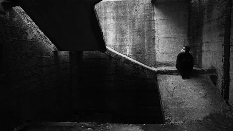 Scared sick person in dark isolation facility.Mental quarantine concept. 库存影片 127870141