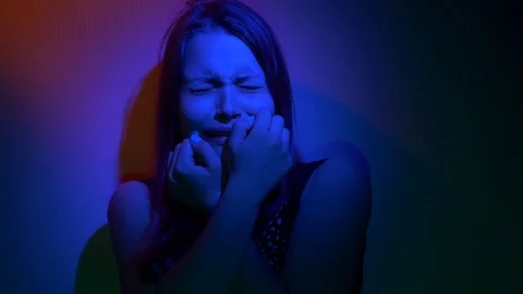 Scared teen girl with in dark Stock Footage