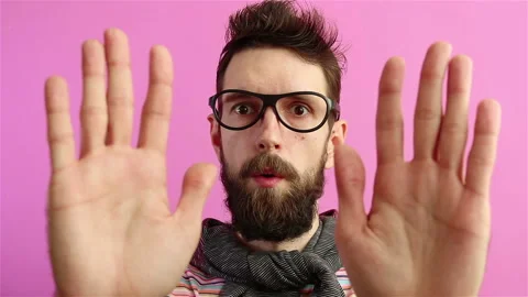Scared terrified shocked bearded man hipster waving hands and saying no Stock Footage 129502892