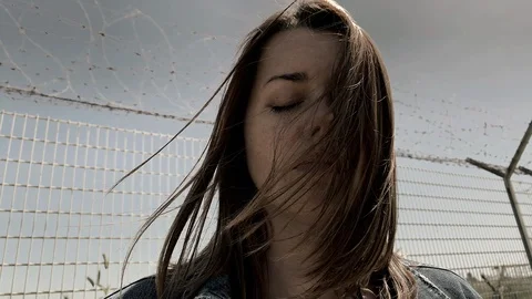 Scared woman in jail looking camera desperate closeup Stock Footage 117934543