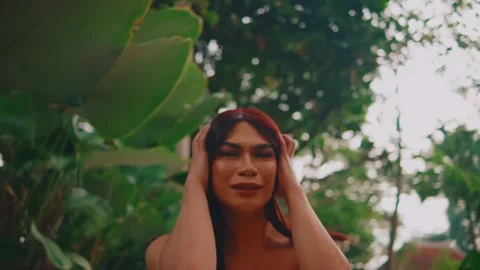 Scared Woman Looking Around While Holding Head in Fear 스톡 동영상 274837116