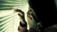 Scared Woman Looking Out The Window Stock Footage
