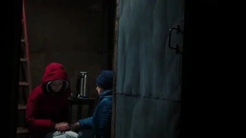 Scared women hiding in the basement of their house Stock-Footage 171534545