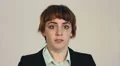 Scared young businesswoman looks around nervously HD Footage