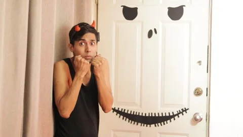 Scared young man on halloween Stock Footage 242963166