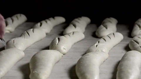 Scarifying the bread dough Video stock 56482674