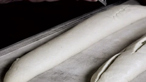 Scarifying the bread dough Stock Footage 56482775