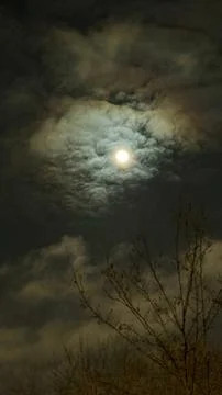 Scary Background with Full Moon Behind Dramatic Clouds Stock Photos