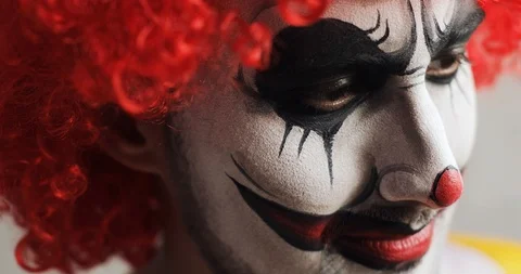 A Man Costumed as Pennywise Making Scary Face Reaction · Free Stock Photo
