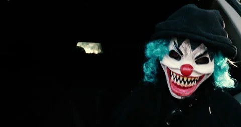 Scary clown walking around during the day Stock Footage 273188439