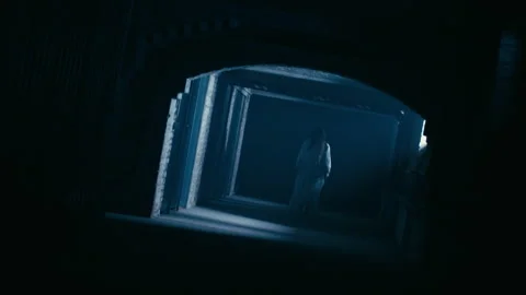 Scary dead Creature Ghost walking threw corridors with light setup Helloween Stock Footage 318956882