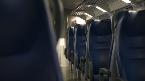 Scary empty wagon of a train, look suspiciously between the seats Stock Footage 124161428