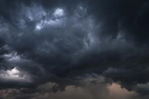 Scary epic sky with menacing clouds. Hurricane wind with a thunderstorm. Stoc Stock Photos