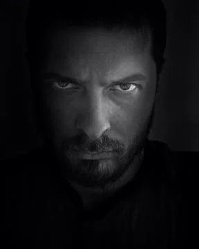 Scary face in the shadow Stock Photos