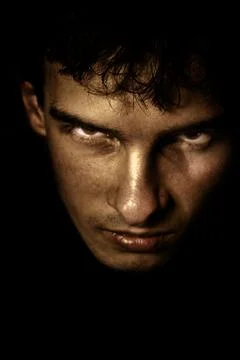 Scary face in the shadow Stock Photos