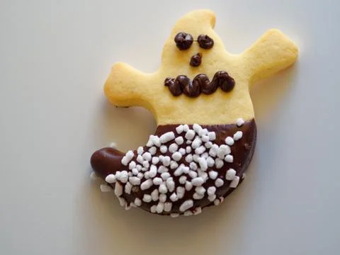 A scary ghost-shaped Halloween cookie. Stock Photos