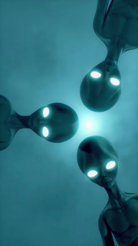 Scary gray aliens looking down at you and blinking against the dark foggy Stock Footage 310963834