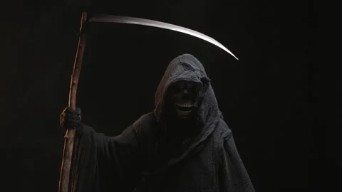 The scary grim reaper. Skeleton, skull, silhouette of a man in a black robe Stock Footage 255093285