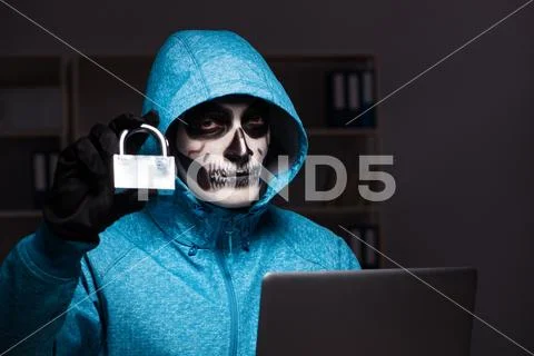 Scary hacker hacking security firewall late in office Stock Photo #89412090