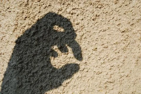 Scary hand shadow Stock Photos