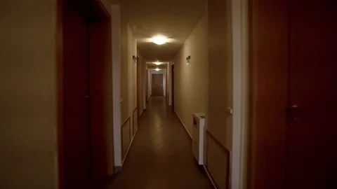 Scary horror corridor hallway in hotel, camera travelling to appartmen door Stock Footage