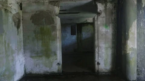Scary horror war corridor war fort concrete abandoned tracking forward to room Stock Footage 127388404