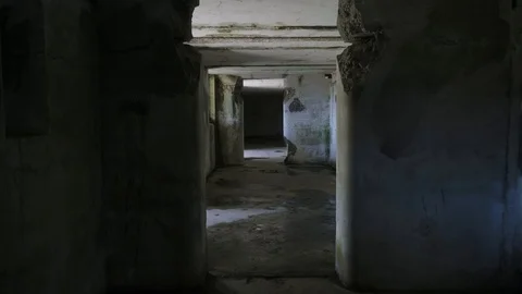 Scary horror war corridor war fort abandoned tracking forward through door Stock-Footage 127388570