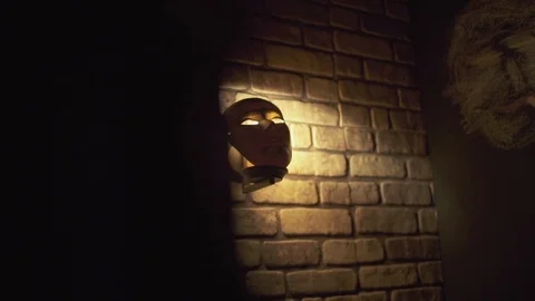Scary mask on the wall Stock Footage 124609536