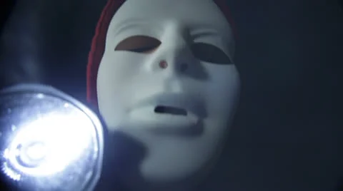 Scary masked man with torch Stock Footage 23852977