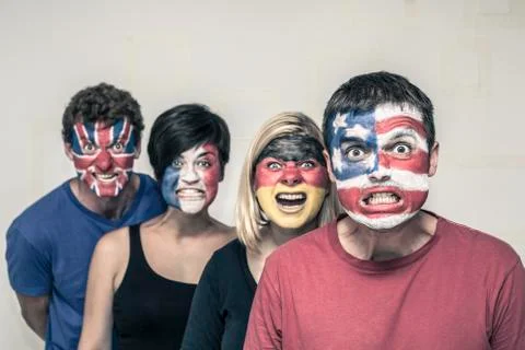 Scary people with flags on faces Stock Photos
