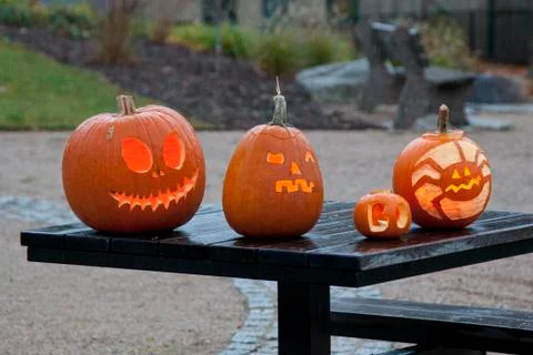 Scary pumpkins on table Stock Photos
