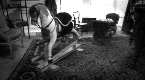 Scary Rocking Horse In Haunted Playroom Stock Footage