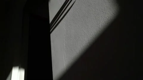Scary shadow of the hand on the wall. The hand is crawling along the wall Video stock 146383177