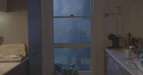 stalker looking through a window