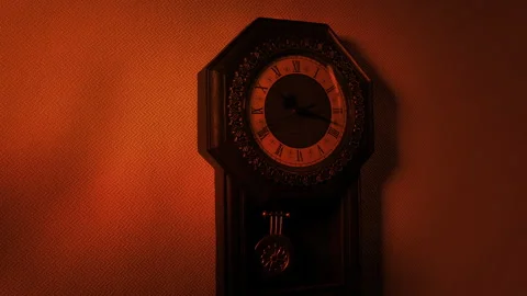 Scary Twisting Shadows Over Antique Wall Clock In Firelight Video stock 249688245