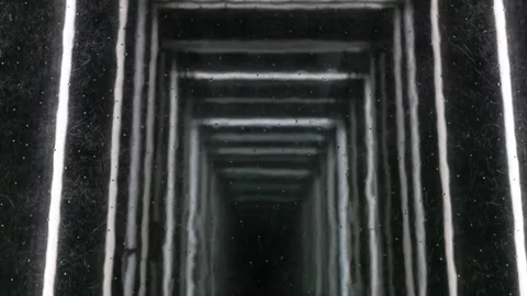Scary view down into elevator shaft through glass floor of cabin. Stock Footage 240950512