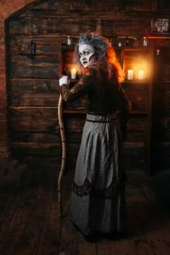 Scary witch with a cane, back view Foto stock