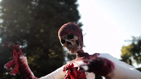 Scary wrapped skeleton close out doors red .mov Stock-Footage 95778117