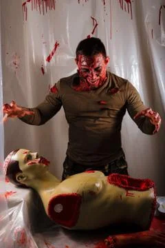Scary zombie with lacerations. blood. horror. breaks its prey. in search of t Photos