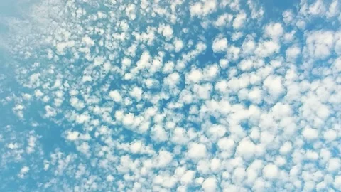 Scattered Altocumulus Clouds Across Blue Sky Stock Footage 340238627