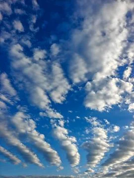 Scattered Altocumulus Wave Clouds Spreading Across Bright Blue Afternoon Sky Stock Photos
