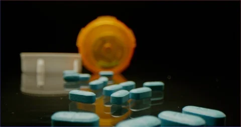 Scattered blue pills on a table macro shot 스톡 동영상 126286591
