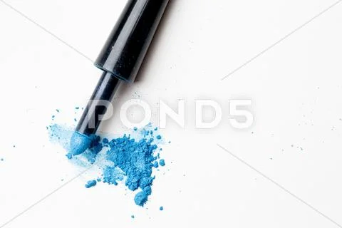 Scattered blue shadows with applicator on pure background Stock Photos