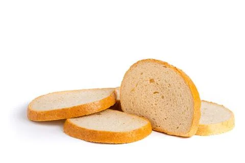 Scattered Bread Slices on White Surface Photos