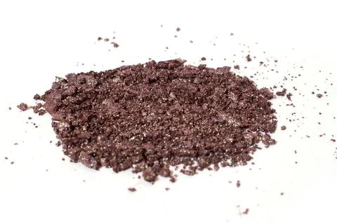 Scattered brown eye shadow isolated on a white background Stock Photos