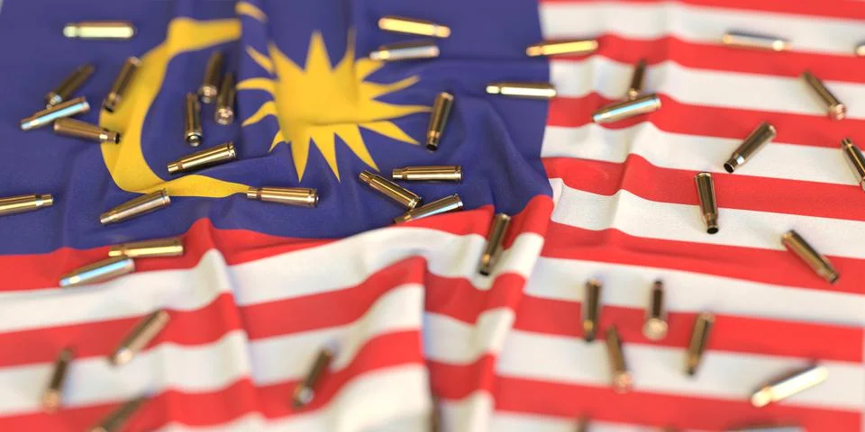 Scattered bullet shells on the flag of Malaysia. Crime or violence related 3D Stock Illustration