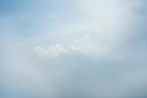 Scattered cloud clusters in a blue sky, blue sky background with white clouds Stock Photos