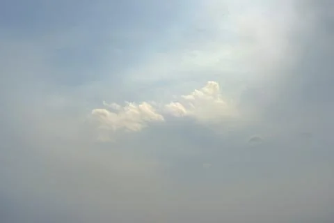 Scattered cloud clusters in a blue sky, blue sky background with white clouds Stock Photos